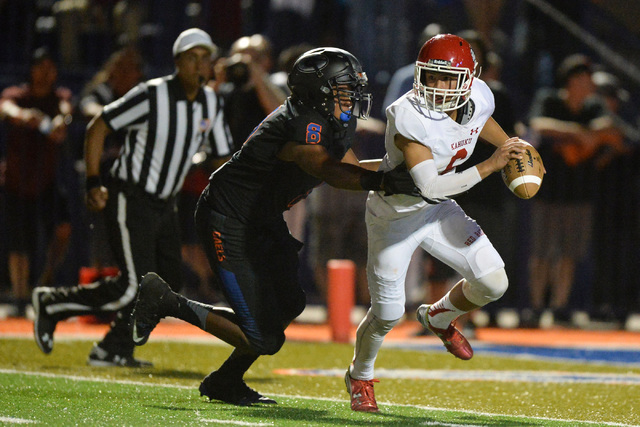 Kahuku quarterback Sol-jay Maiava (6) is sacked by Bishop Gorman defensive end Adam Plant (8 ...