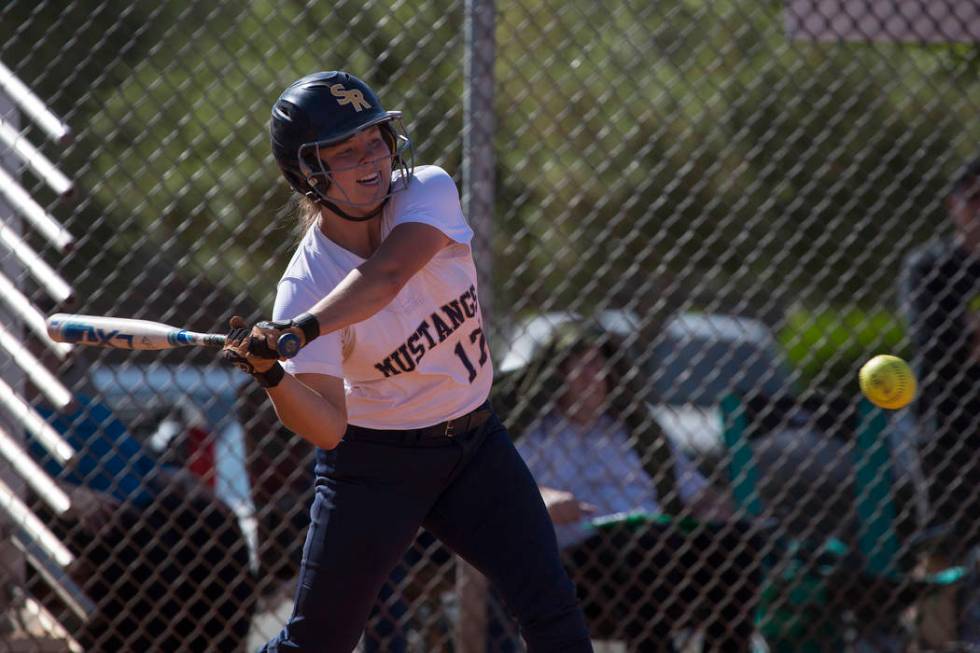 Shadow Ridge junior Alisha Schultz swings at the ball during a game against Centennial at Sh ...