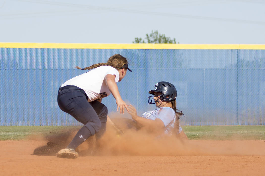 Centennial senior Brianna Benoit, right, slides safely into second for a stolen base as Shad ...