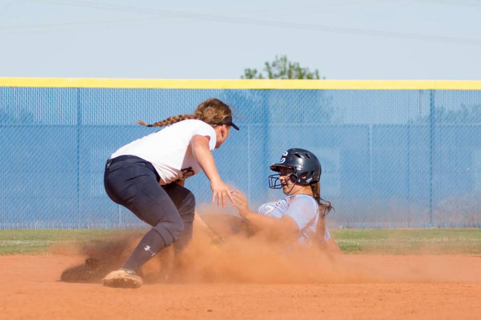 Centennial senior Brianna Benoit, right, slides safely into second for a stolen base as Shad ...