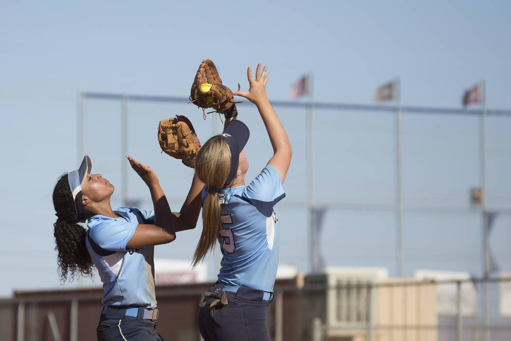 Centennial junior Seanna Simpson, right, catches the ball during a game against Shadow Ridg ...