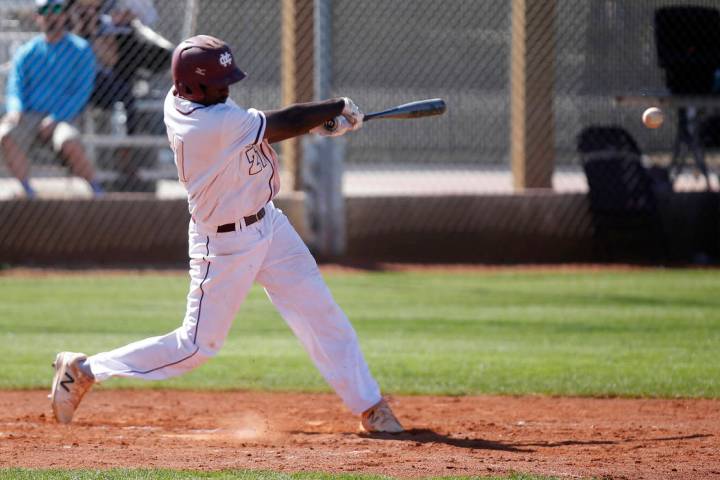 Cimarron-Memorial’s Lasith Narasinghe (21) swings during the first inning of a high sc ...