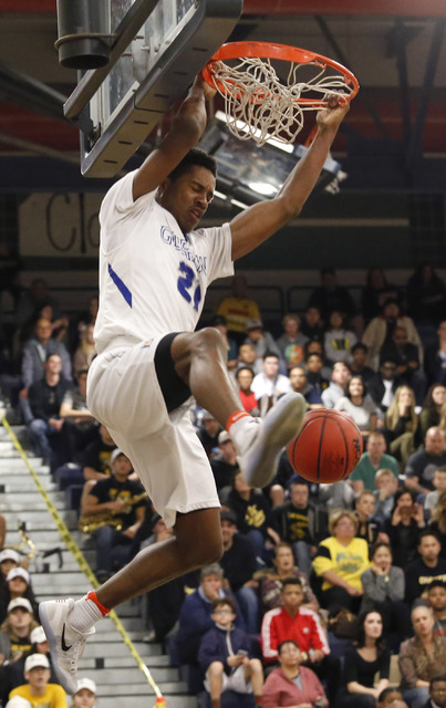 Bishop Gorman’s Christian Popoola (21) dunks during the second half of a Class 4A Suns ...