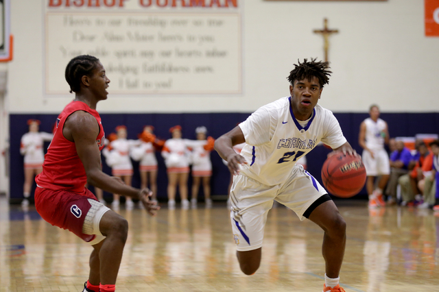 Gorman Bishop’s forward Christian Popoola (21) goes to pass Coronado’s guard Nic ...