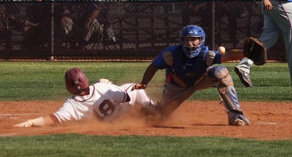 Bishop Gorman catcher Michael Blasko, right, awaits a throw during a game against Cimarron-M ...