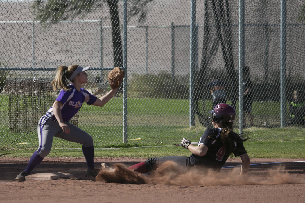 Durango junior Isabel Perez prepares to catch the ball as Desert Oasis sophomore Holly Sever ...