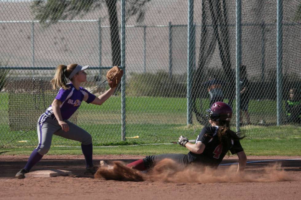 Durango junior Isabel Perez prepares to catch the ball as Desert Oasis sophomore Holly Sever ...