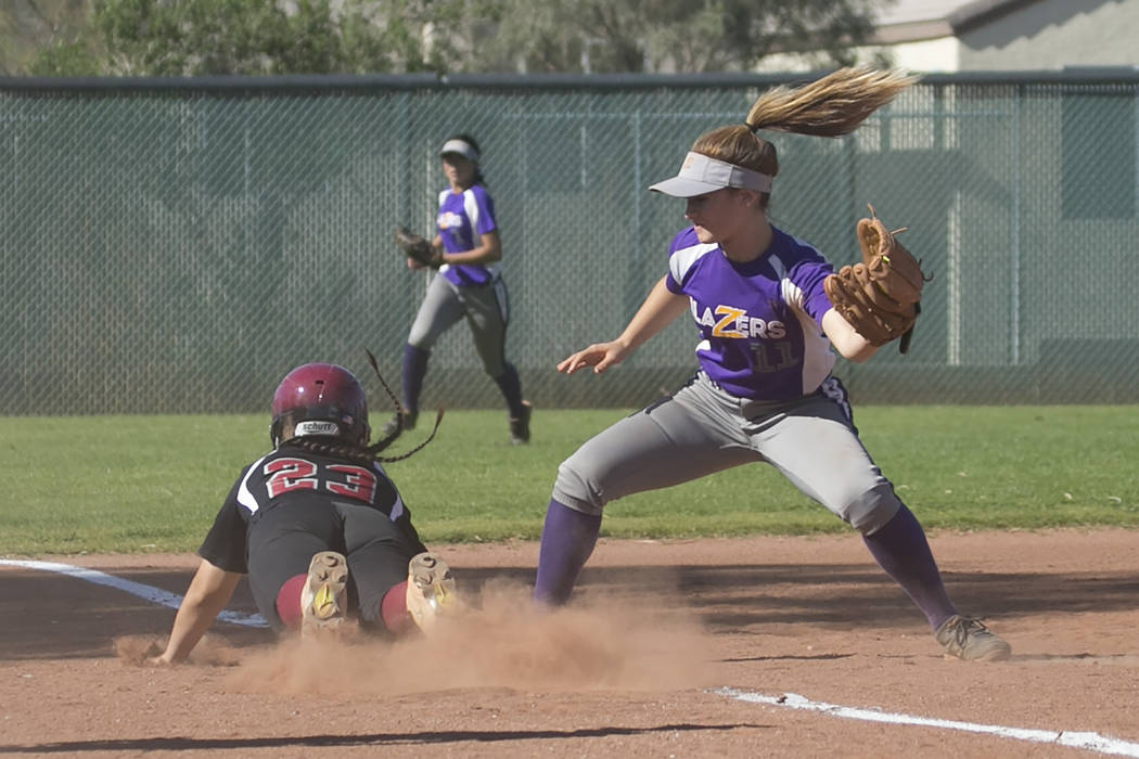 Durango junior Isabel Perez guards third as Desert Oasis sophomore Makayla Rickard slides i ...