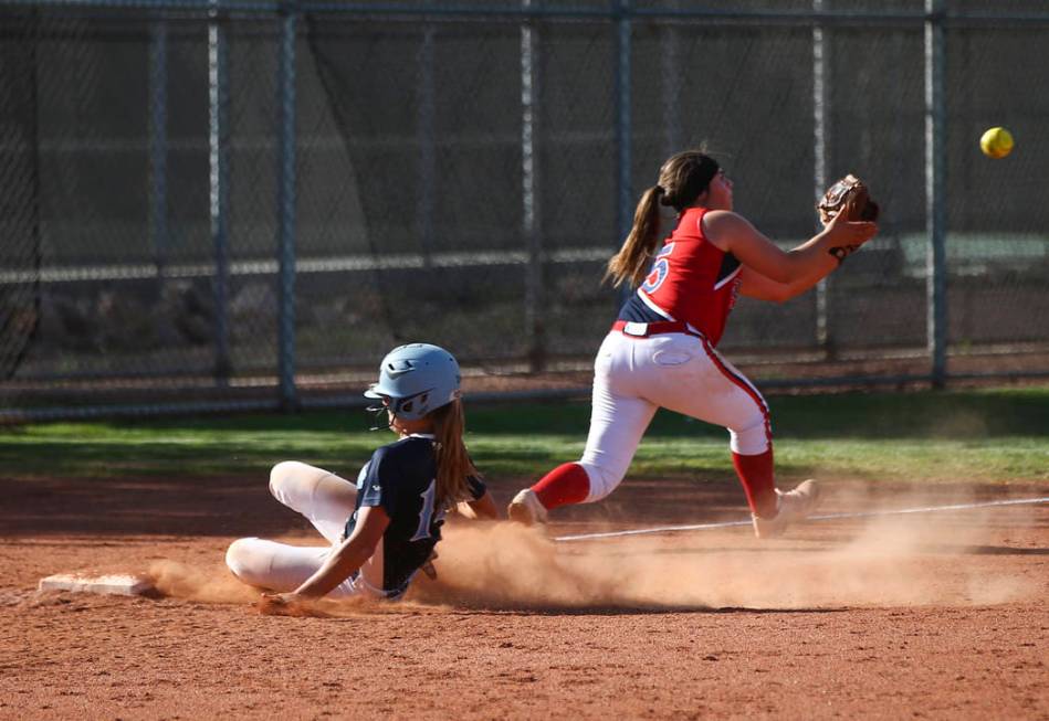 Foothill’s Jocelyn Shupp (14) slides into third base against Liberty’s Breanna A ...