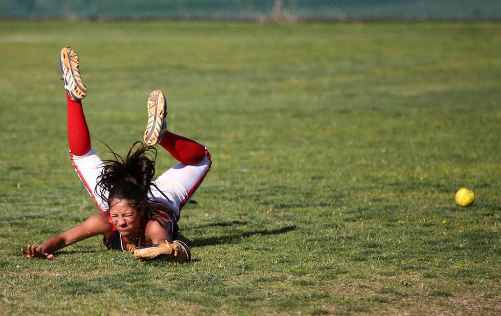 Liberty’s Jasmine Gonzalez (99) misses a fly ball from Foothill during a baseball game ...