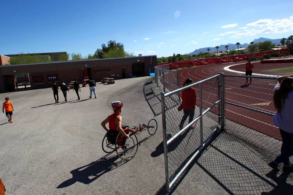 Arbor View freshman Blake Dickinson prepares to compete in the 100-meter dash during a track ...