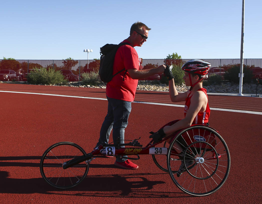 Arbor View coach Tyrel Cooper, left, congratulates freshman Blake Dickinson, who came in ahe ...