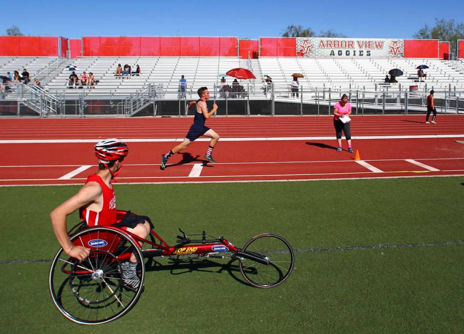 Arbor View freshman Blake Dickinson, left, between events during a track and field meet at A ...