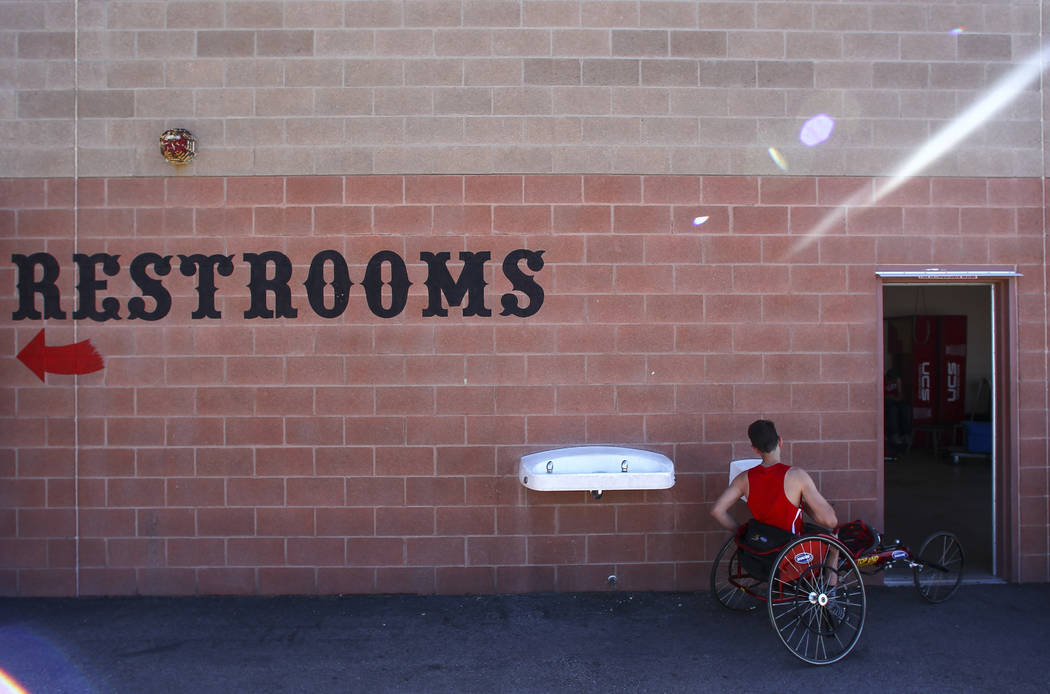 Arbor View freshman Blake Dickinson gets a drink of water between events during a track and ...