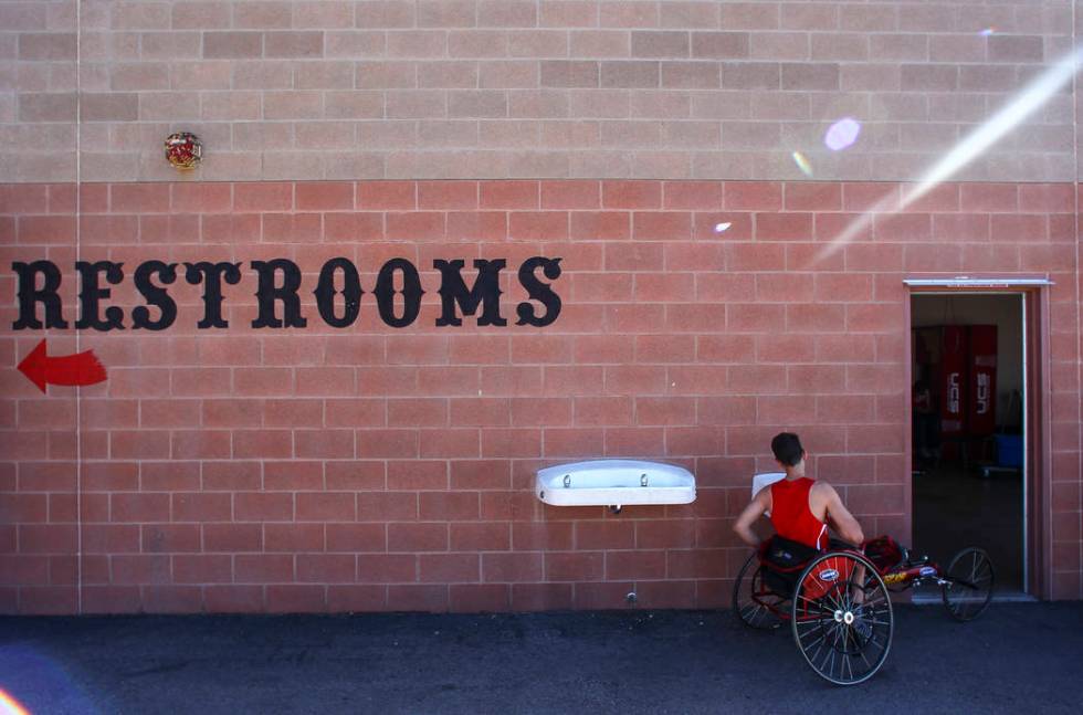 Arbor View freshman Blake Dickinson gets a drink of water between events during a track and ...