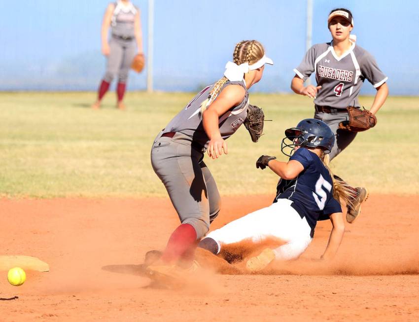 Centennial’s Seanna Simpson (5) successfully slides to second base against Faith Luthe ...