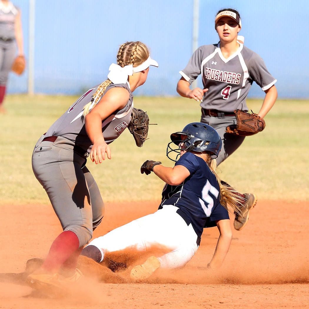 Centennial’s Seanna Simpson (5) successfully slides to second base against Faith Luthe ...