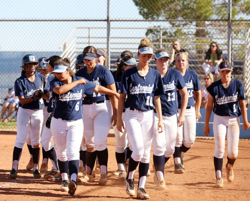 Centennial players greet their teammate Kiana Tate (4), far left, after her home run against ...