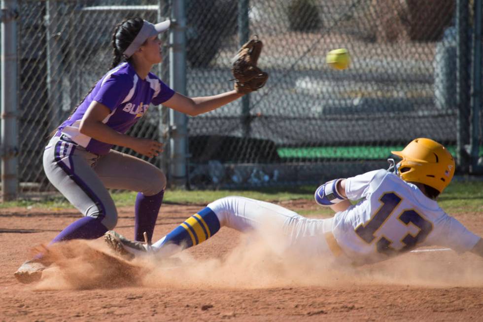 Sierra Vista’s Daelynn Hilton (13) slides to home plate for a score against Durango&#8 ...