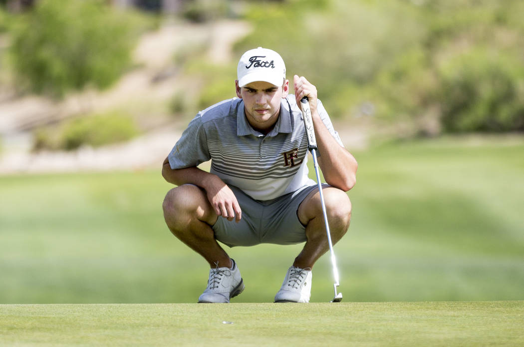 Faith Lutheran’s Charlie Magruder lines up his shot on the 18th hole during Sunset Reg ...