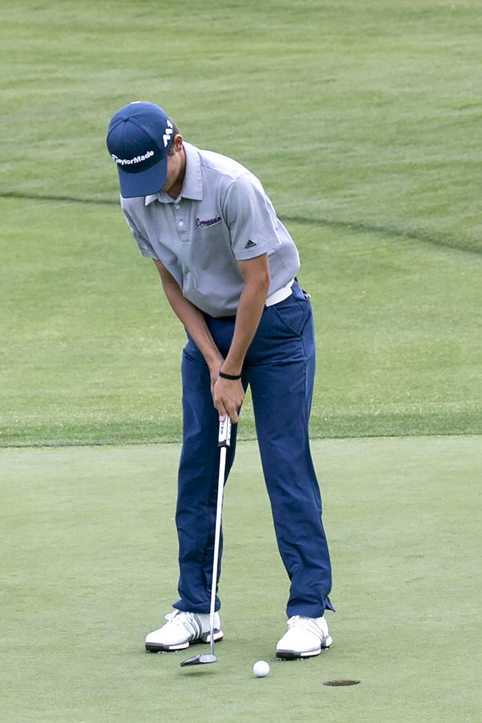 Coronado sophomore Joey Dotta hits the ball on the 14th hole of the Sunrise Region golf tour ...