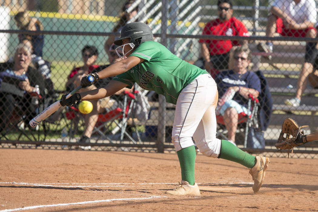 Rancho teammates cheer from the dugout during a Sunrise Region softball tournament game agai ...