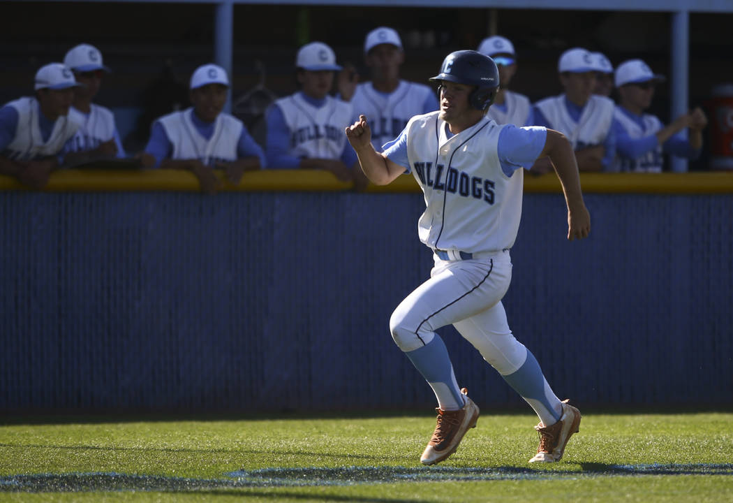 Centennial’s Austin Kryszczuk heads for home base to score a run against Desert Oasis& ...