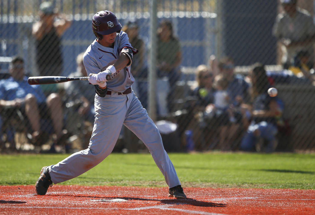 Desert Oasis’ Cole Schaefer swings at a pitch from Centennial during a Sunset Region b ...