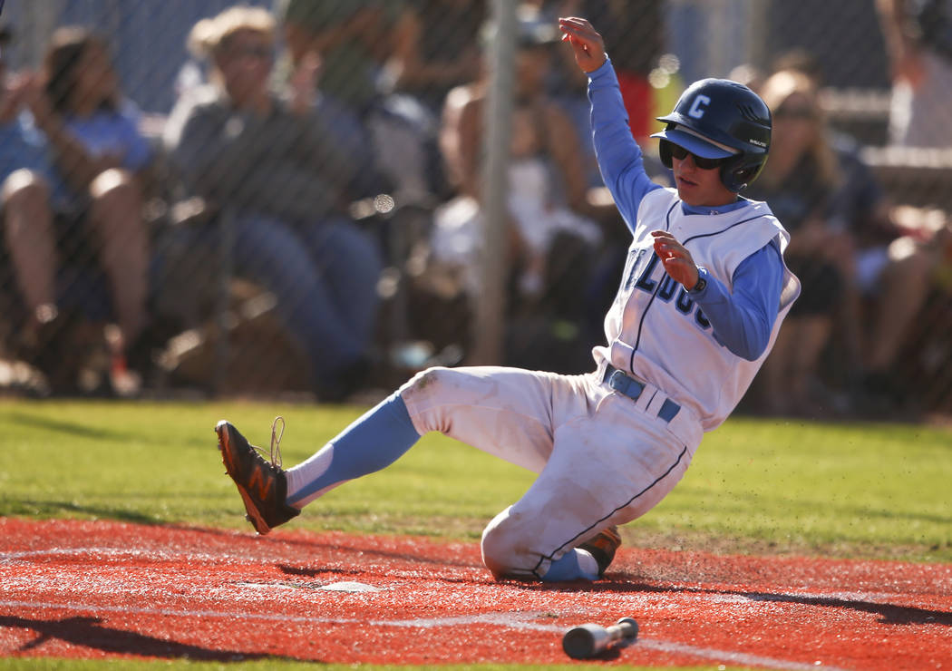 Centennial’s Cole Sliwoski scores a run against Desert Oasis during a Sunset Region ba ...