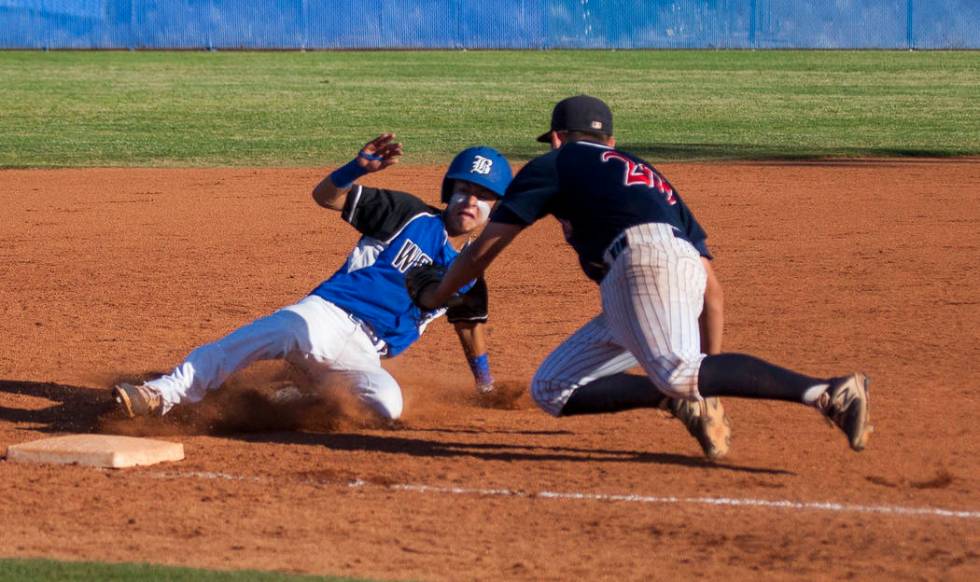 Coronado’s Cristian Herrera tags out a Basic player at third at Basic High School in H ...