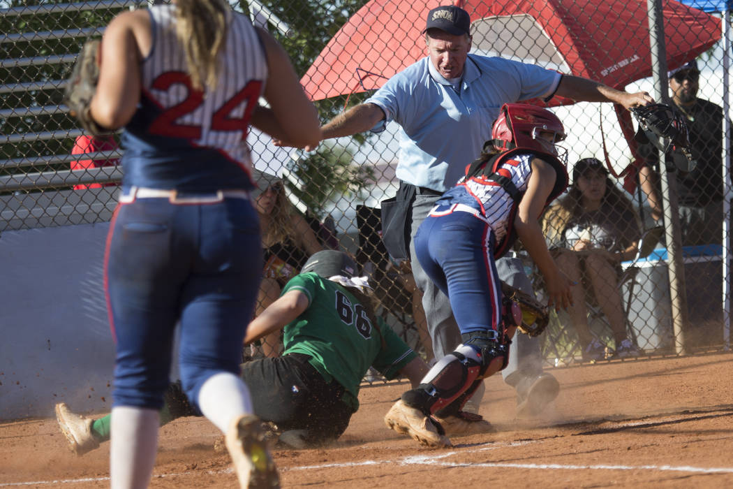 Rancho’s Gianna Carosone (66) slides safe at home plate for a run against Liberty at F ...