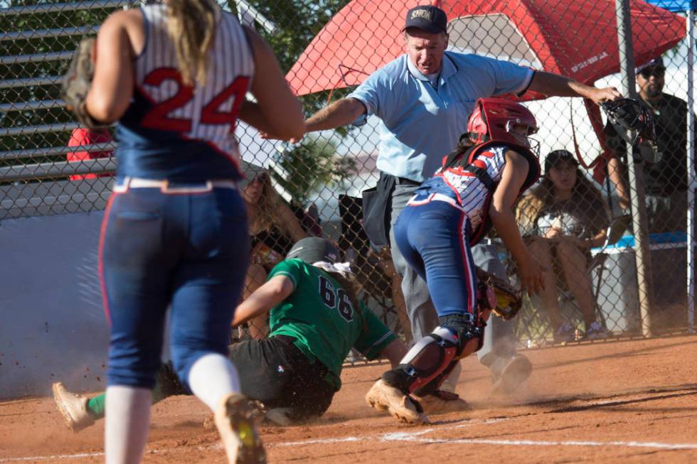 Rancho’s Gianna Carosone (66) slides safe at home plate for a run against Liberty at F ...