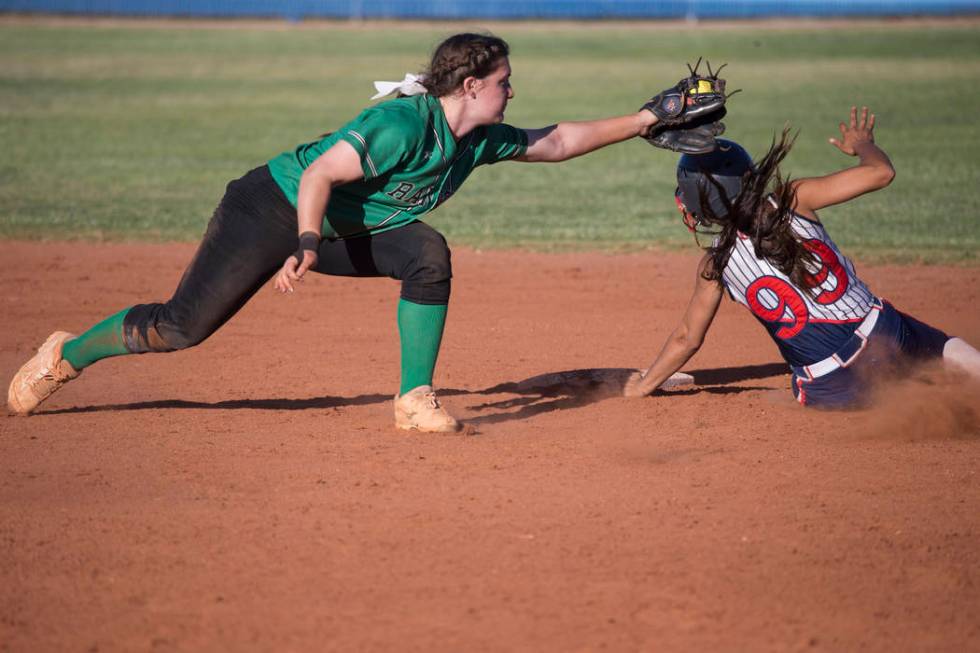 Rancho’s Gianna Carosone (66) is late to tag Liberty’s Jasmine Gonzalez (99) at ...