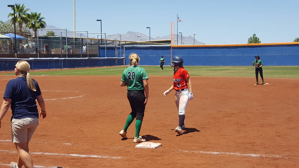 Coronado senior Dylan Underwood (4) retreats to first base after one of her four hits in the ...