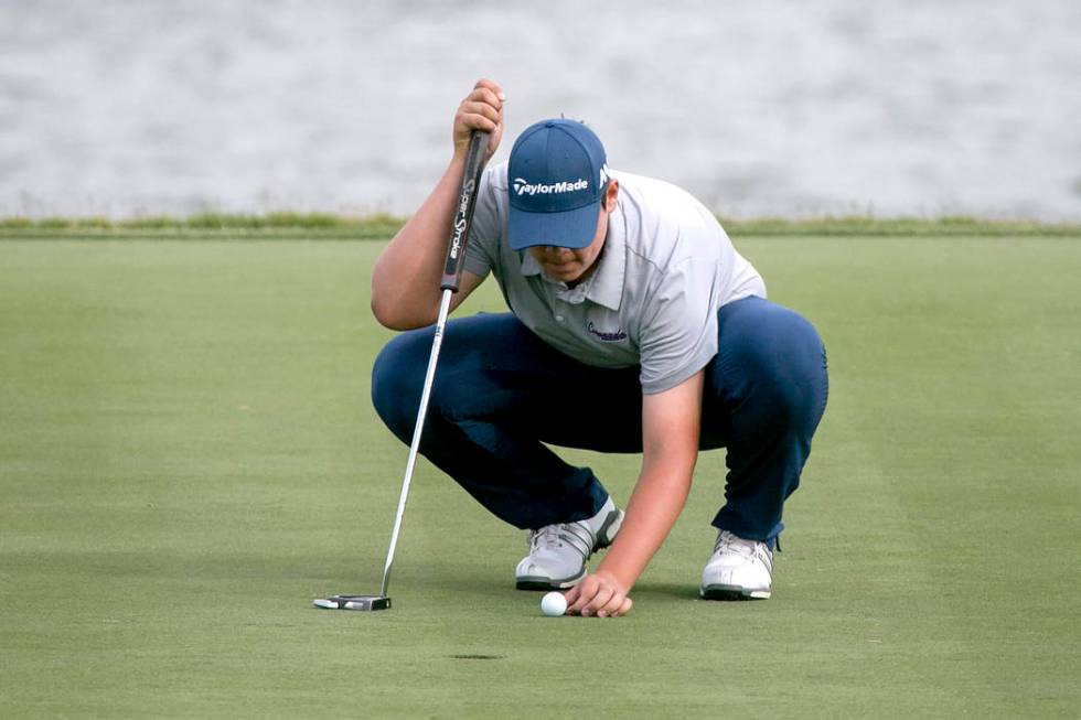 Coronado sophomore Dylan Fritz prepares to hit the ball of the Sunrise Region golf tournamen ...