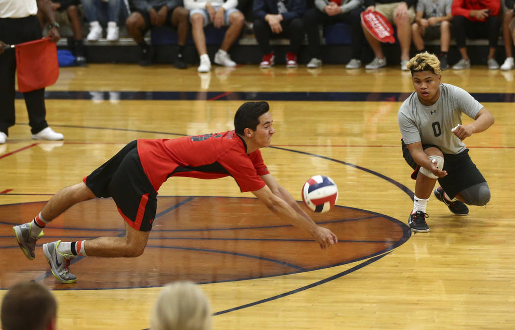 Las Vegas’ Jon Sosa dives to save the ball during the Class 4A boys state semifinal vo ...