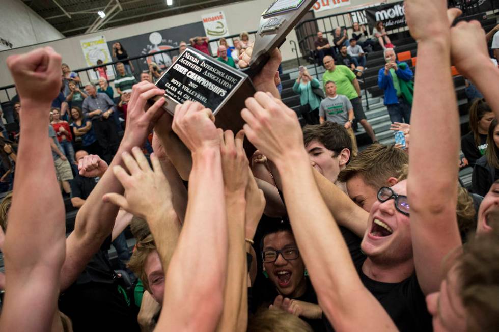 Palo Verde celebrates their win over Las Vegas High during the Class 4A state volleyball fin ...