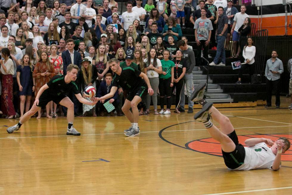 Palo Verde seniors Haden Van Orden (4), left, and Davis Waid (6), center, attempt to save th ...