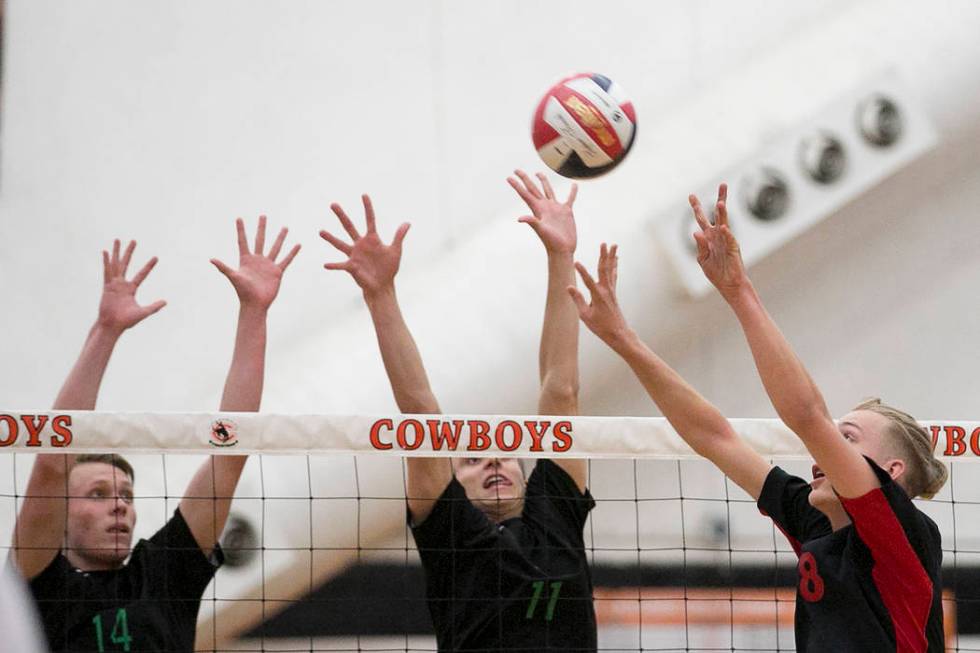 Las Vegas junior Shaun Kampshoff (8), right, attempts to hit the ball over the net as Palo V ...