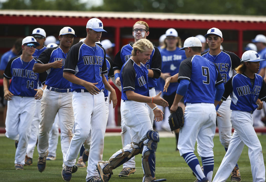 Basic players congratulate pitcher C.J. Dornak (9) after the team defeated Galena 12-0 in 5 ...