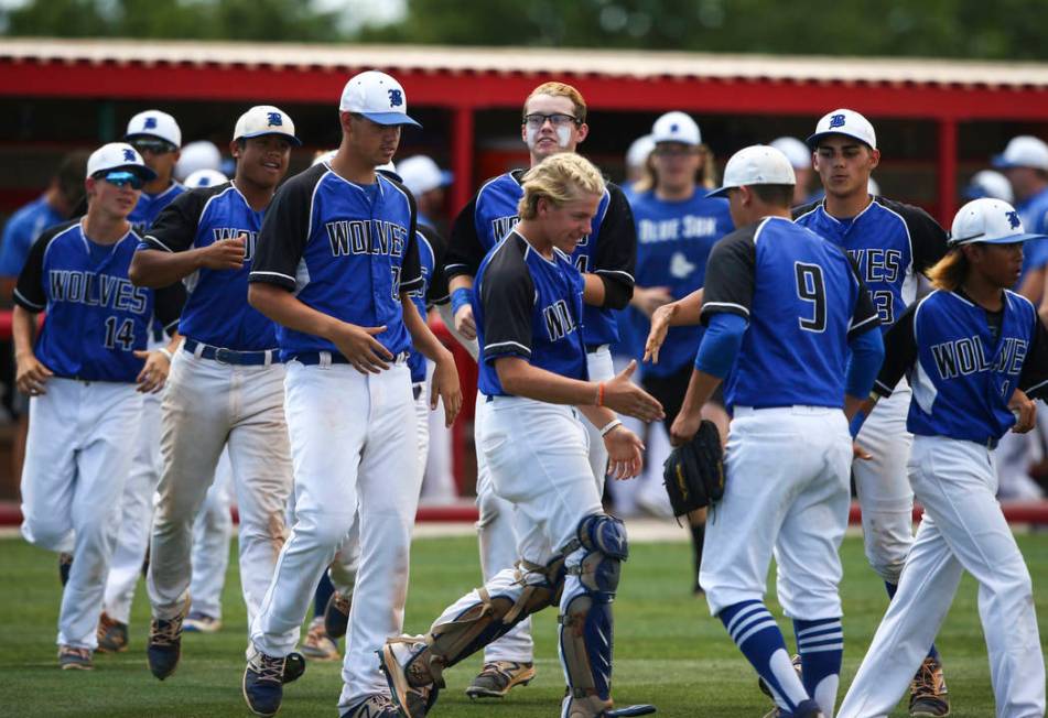 Basic players congratulate pitcher C.J. Dornak (9) after the team defeated Galena 12-0 in 5 ...