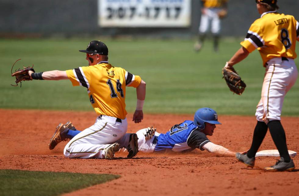 Basic’s Paul Myro (21) makes it safely back to second base against Galena’s Andr ...