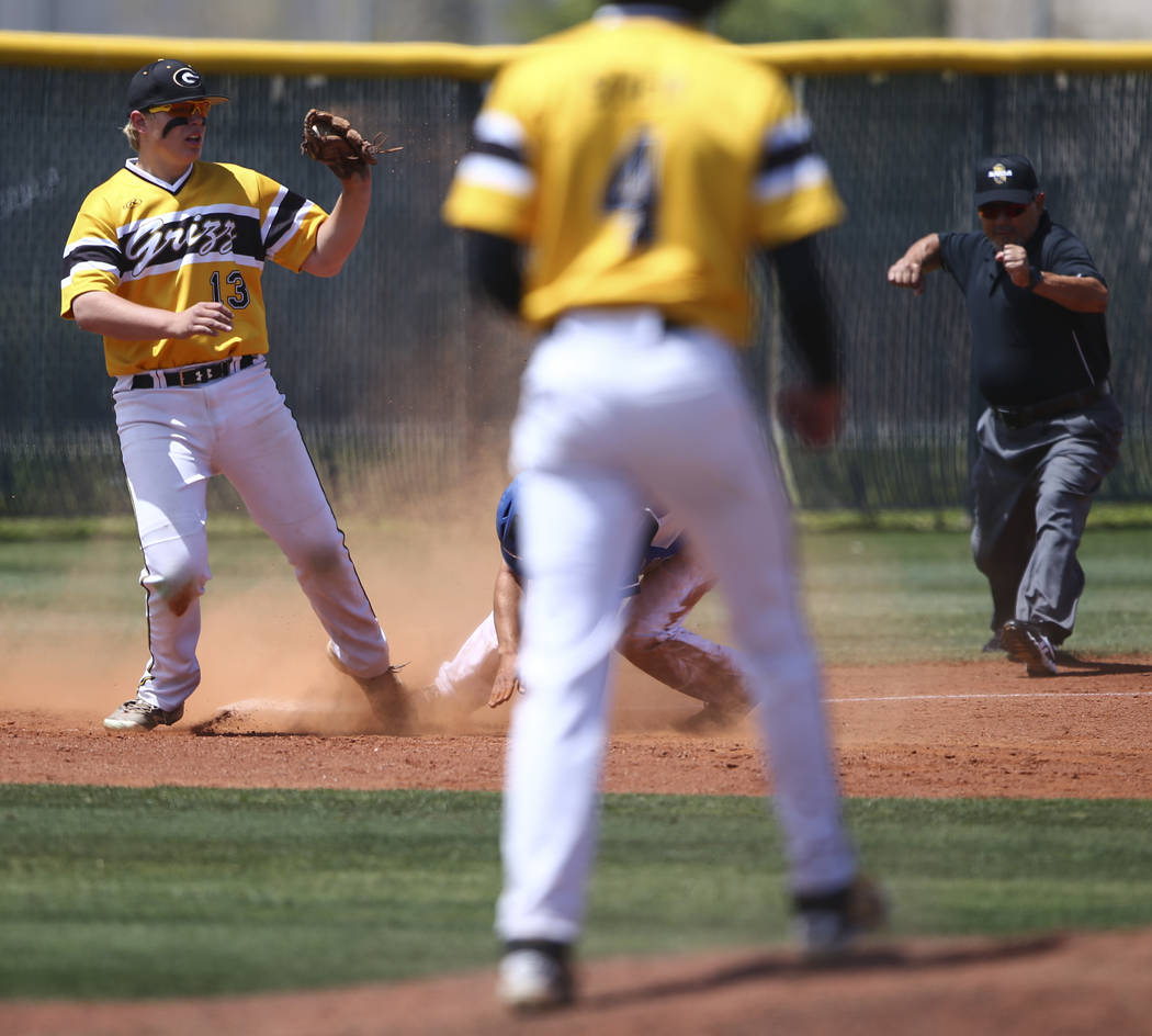 Galena’s Nick Myers (13) tags out Basic’s Nick Thompson during a Class 4A state ...