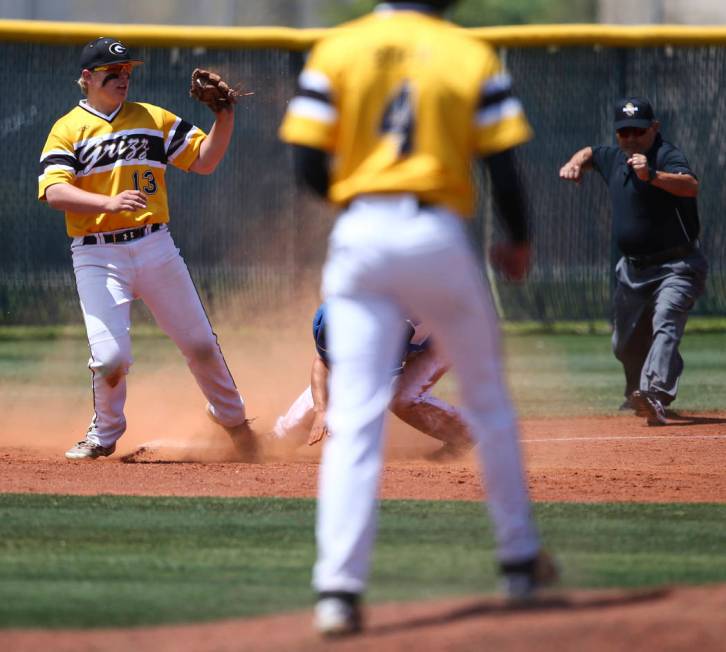 Galena’s Nick Myers (13) tags out Basic’s Nick Thompson during a Class 4A state ...