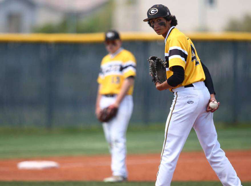 Galena’s Brandon Scheid (4) glances at first base before pitching to Basic during a Cl ...