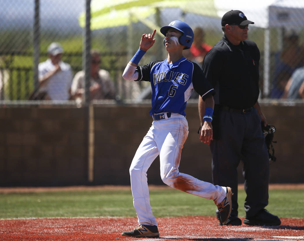 Basic’s John Howard Bobo (6) scores a run against Rancho during a Class 4A state baseb ...