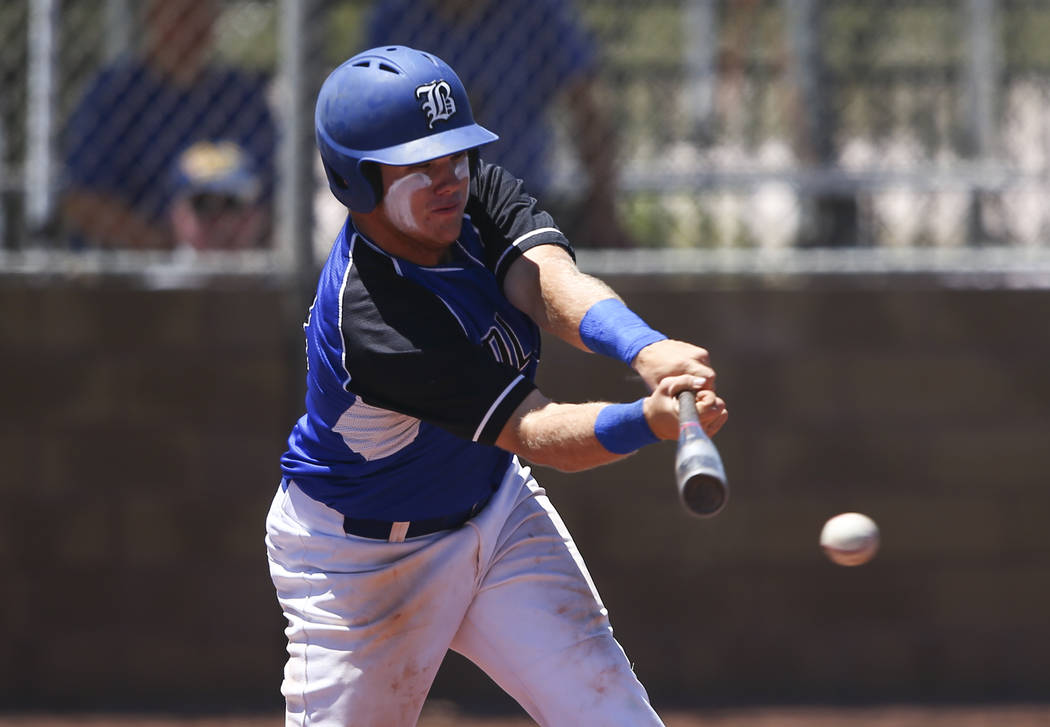 Basic’s Trace Evans hits against Rancho during a Class 4A state baseball tournament ga ...