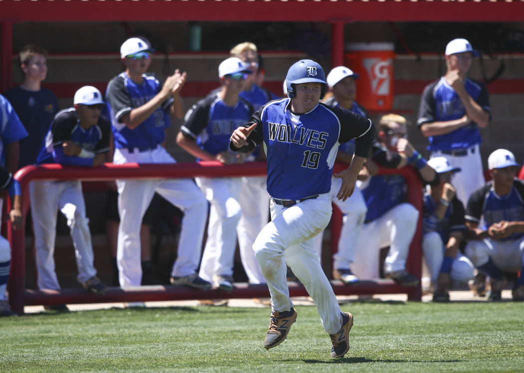 Basic’s Jack Wold (19) heads for home base to score a run against Rancho during a Clas ...