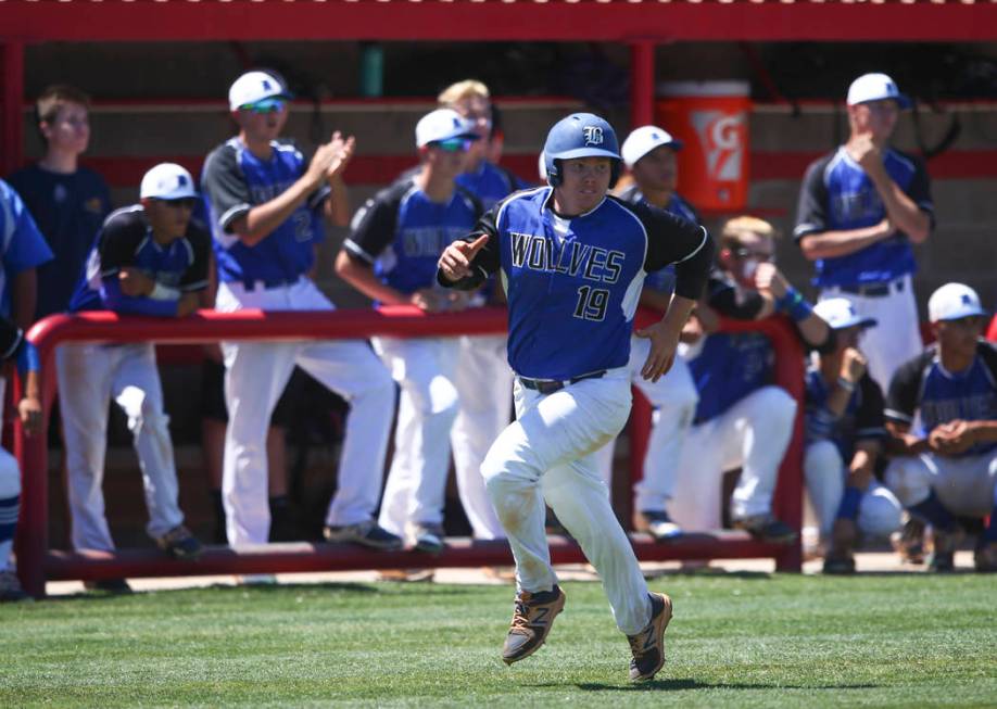 Basic’s Jack Wold (19) heads for home base to score a run against Rancho during a Clas ...