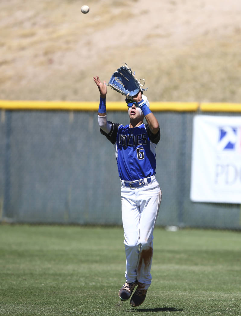 Basic’s John Howard Bobo (6) catches a fly ball from Rancho’s Kagen Kennedy, not ...